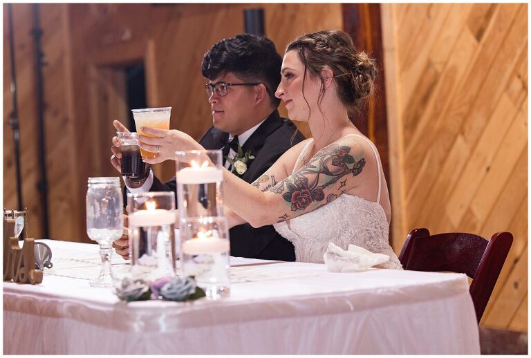 newlyweds toasting at wedding