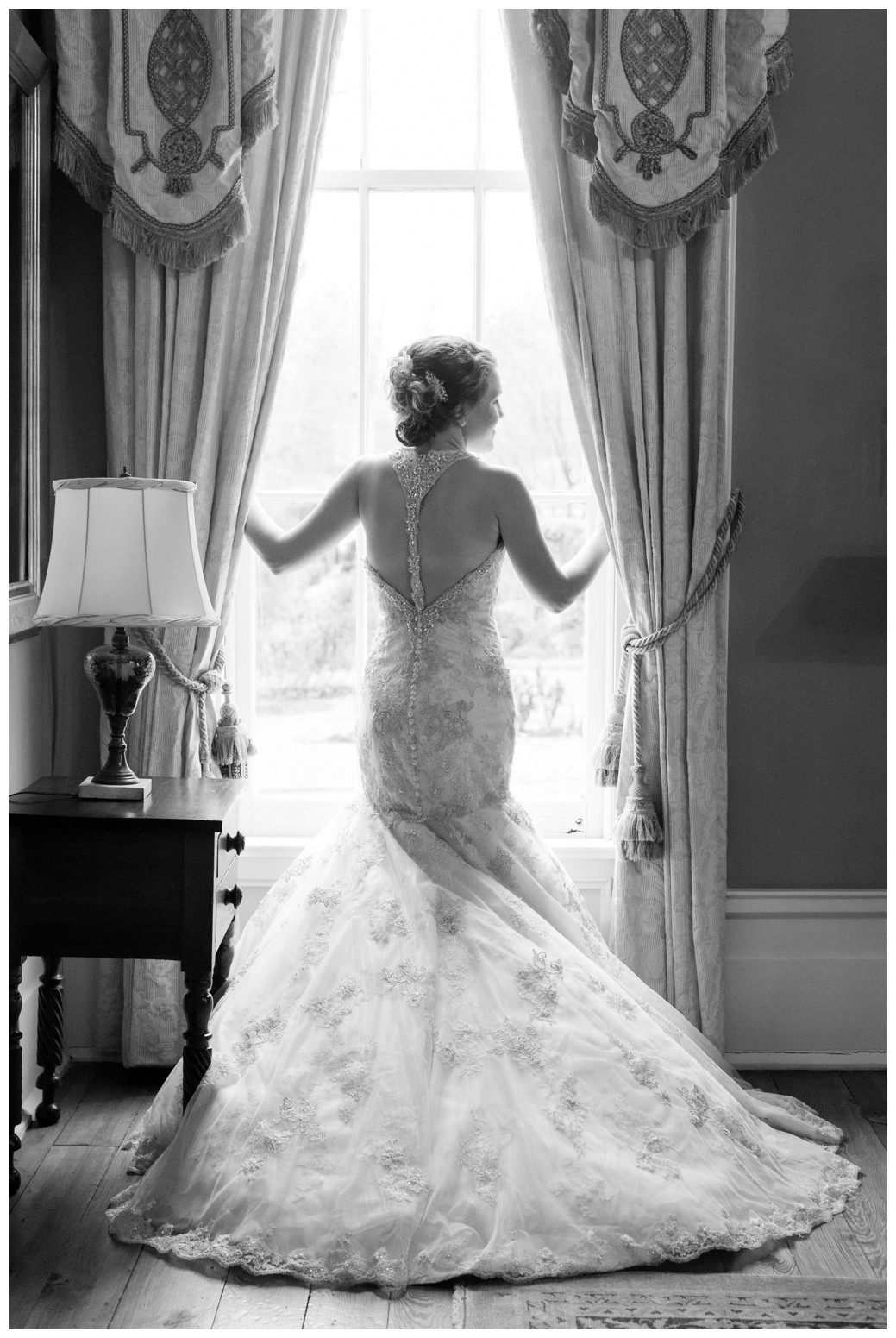 The Columns of Bolivar bridal by window black and white