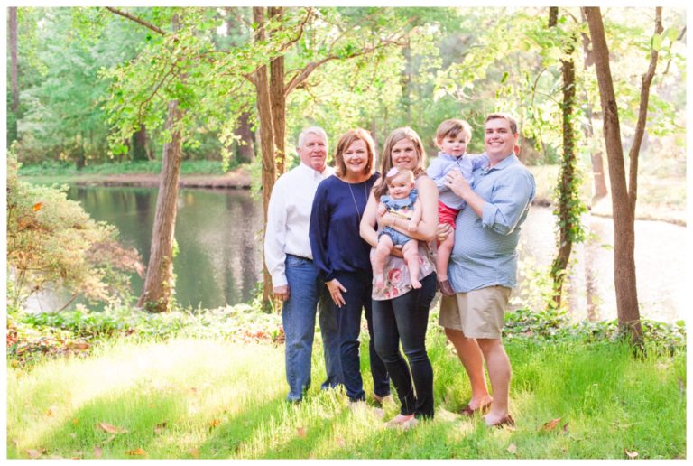 Family by the pond in Vann Gardens