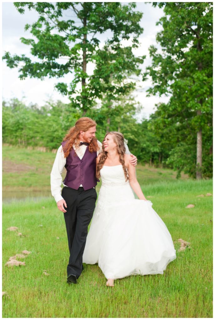 Horseshoe Lake Venue Huron TN bride and groom walking