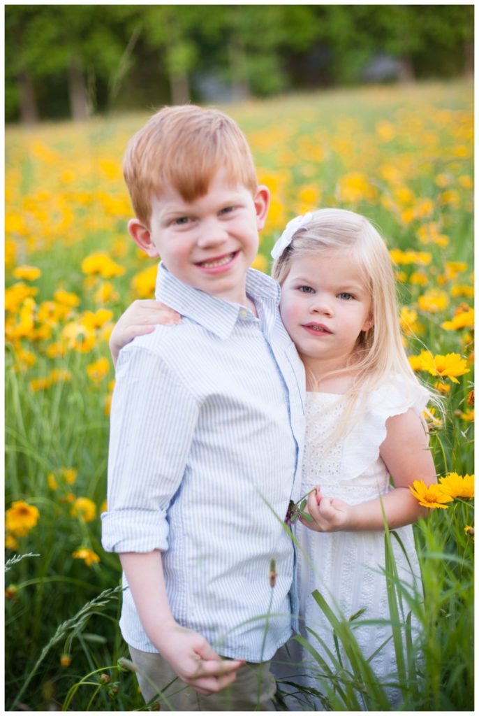 Wildflowers pictures red headed boy hugging blonde girl