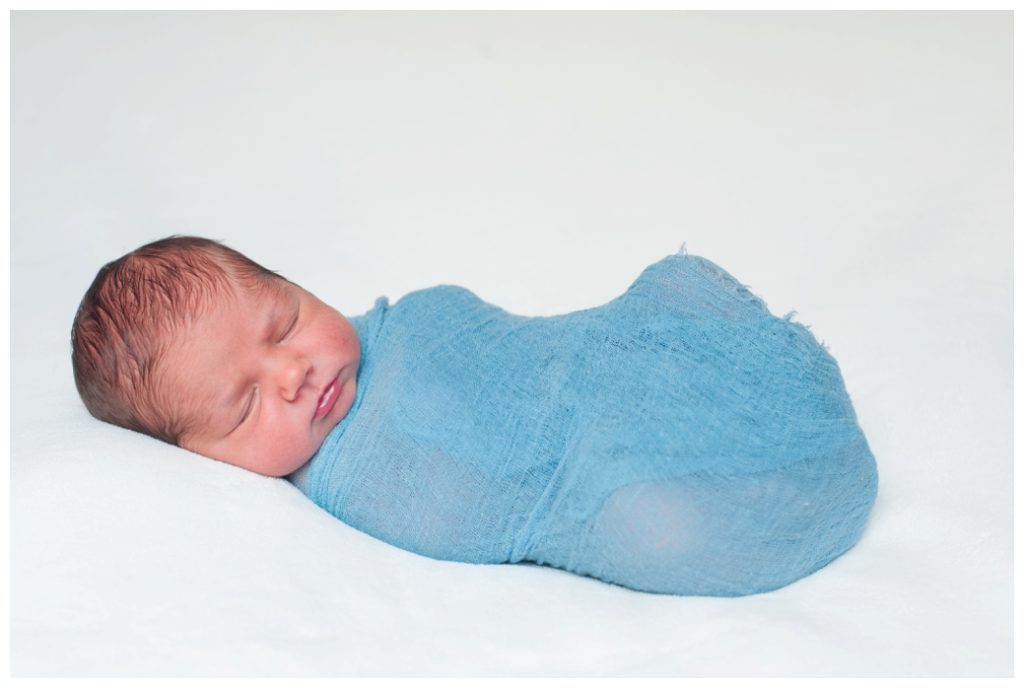 Graham Newborn in blue wrap