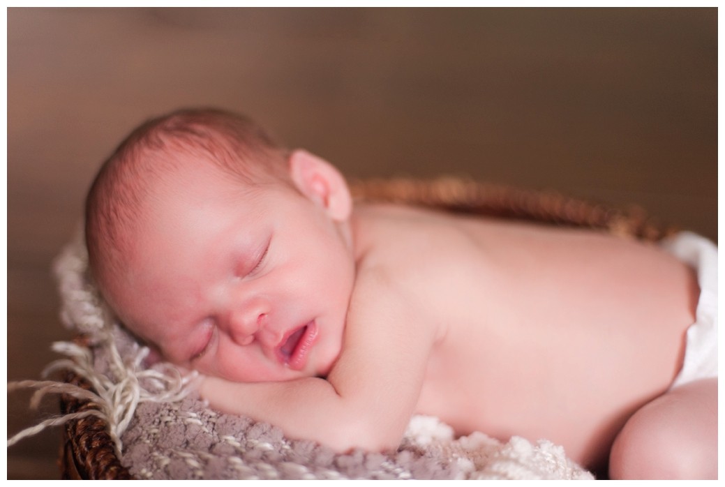 newborn baby in basket