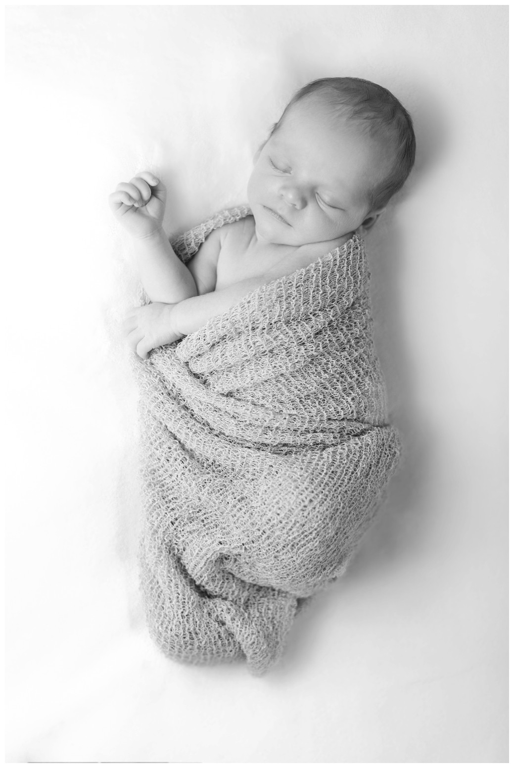 newborn baby in black and white