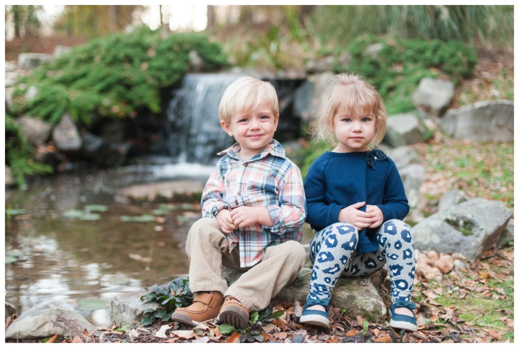 Fall Mini Sessions 2017 twins smiling by waterfall