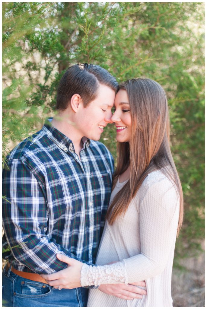 Engagement Session Bolivar TN couple looking at each other in tree