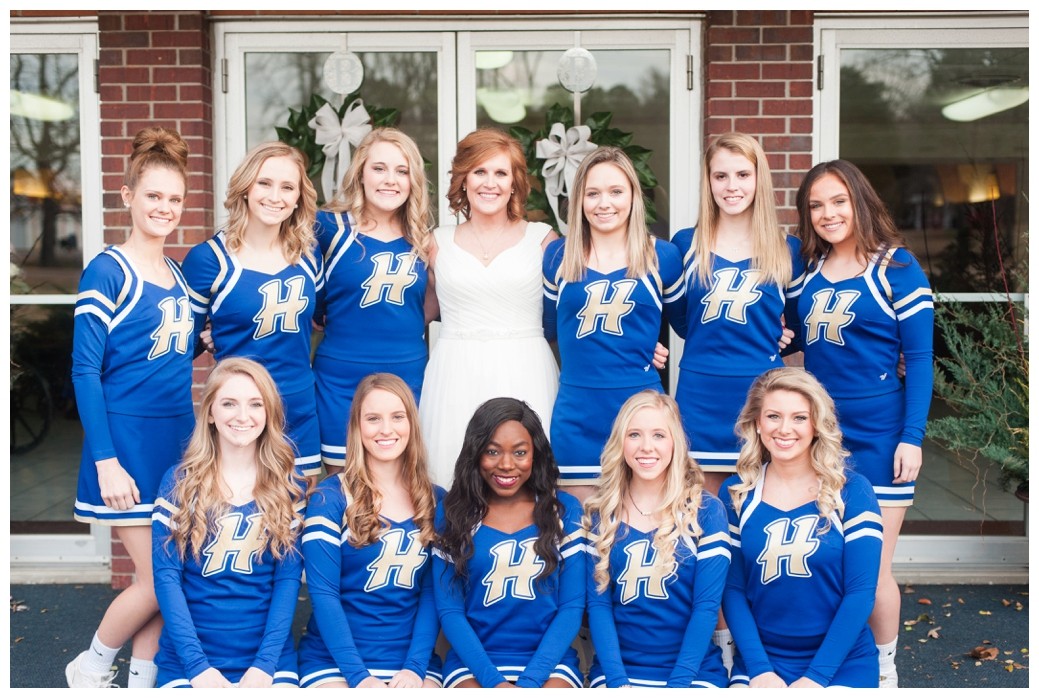 bride with the cheerleading squad she coaches