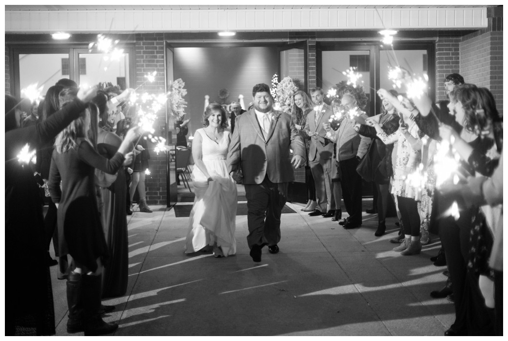 bride and groom sparkler exit black and white