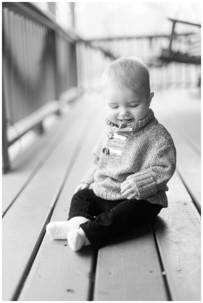 six month session little boy looking down