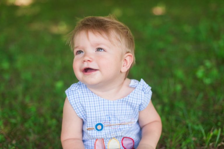 first birthday party smiling boy