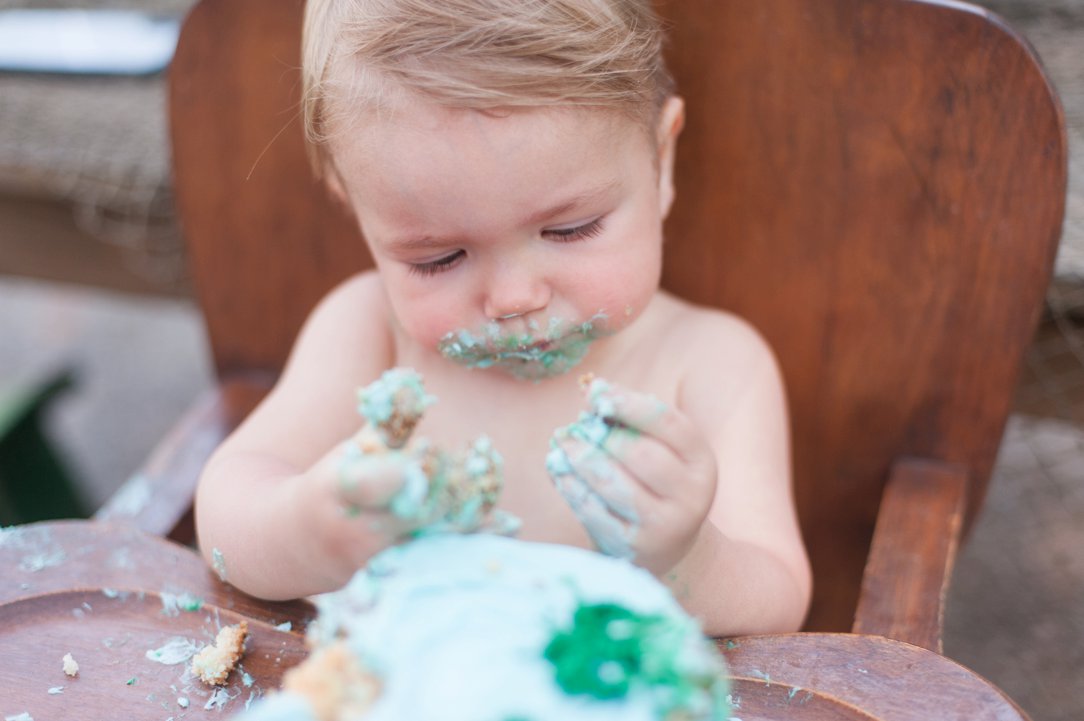 first birthday party eating cake 4