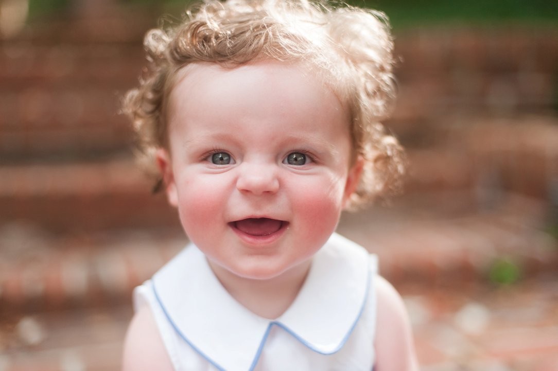 six-month-old portrait little boy with nose scrunched