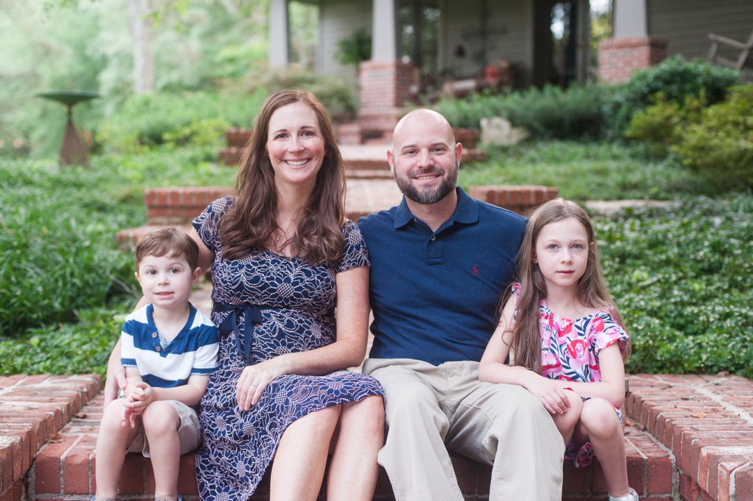 the lewis family sitting on steps