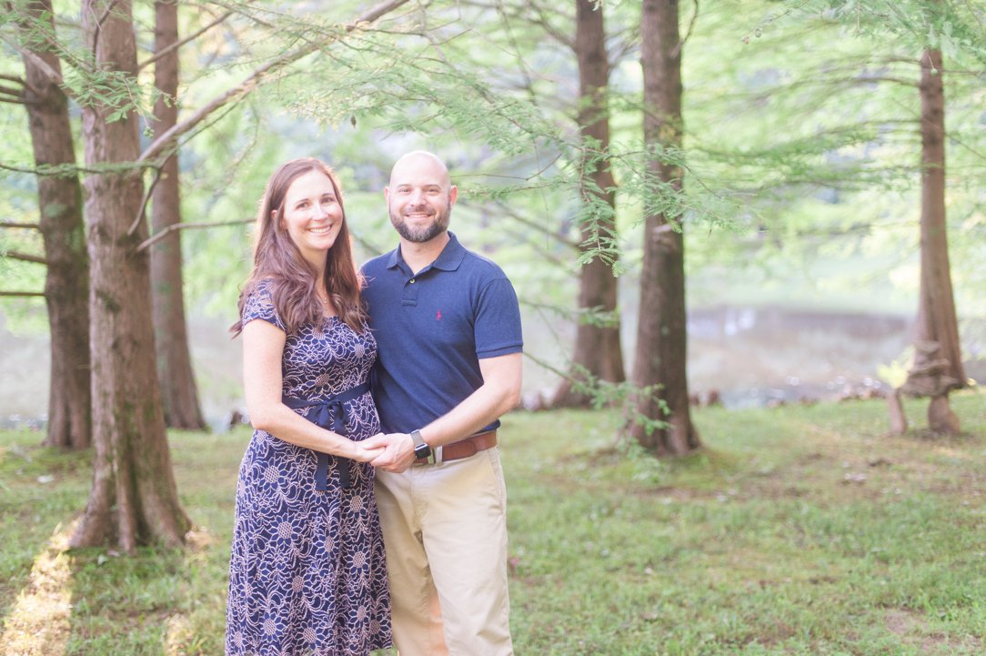 the lewis family mom and dad standing in trees