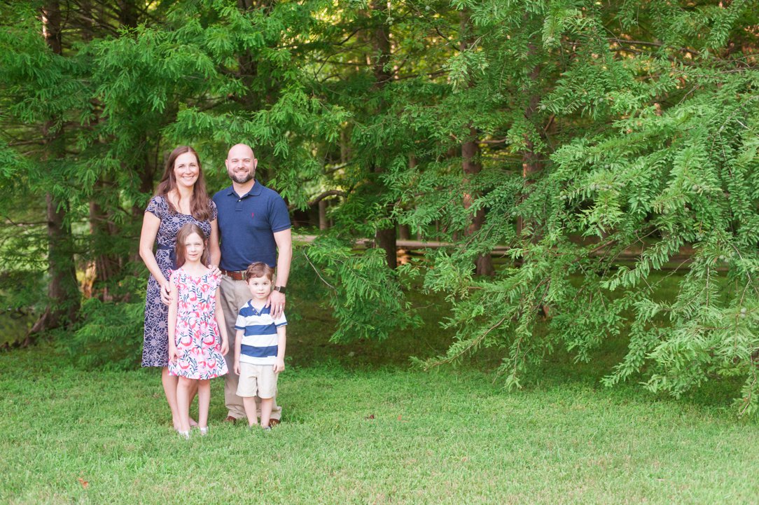 the lewis family standing near trees