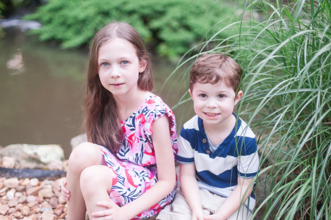 the lewis family kids sitting on rock