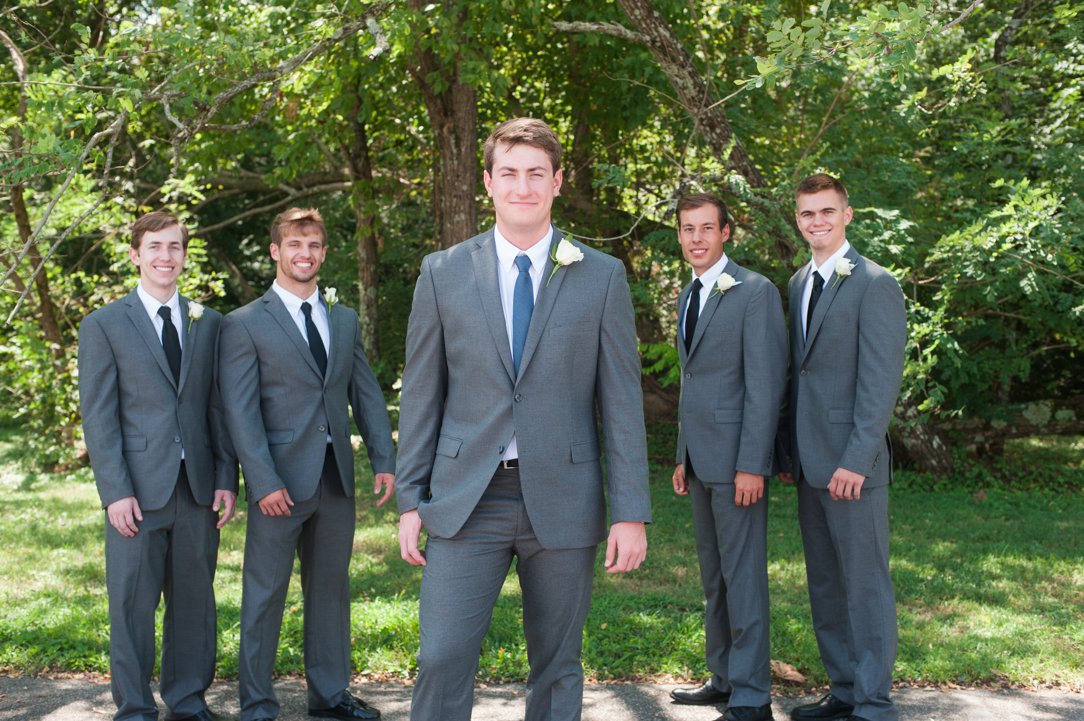 The colonial tea room groom with groomsmen in blue ties