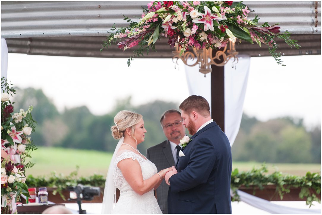 The Venue at Waddell Place ceremony holding hands