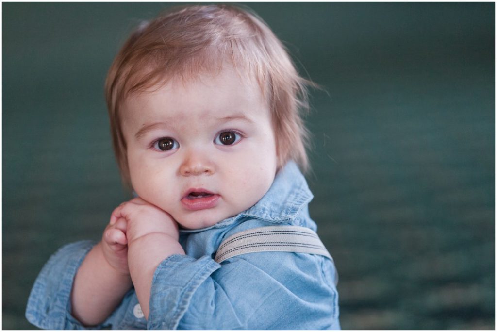 The New Southern portrait session little boy with hands by face