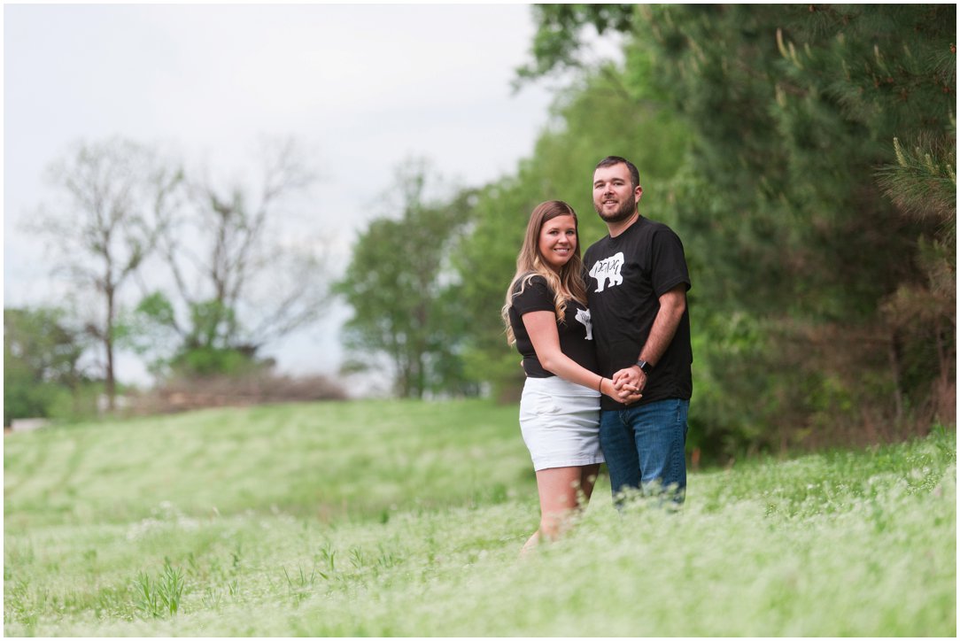 baby announcement couple in matching shirts