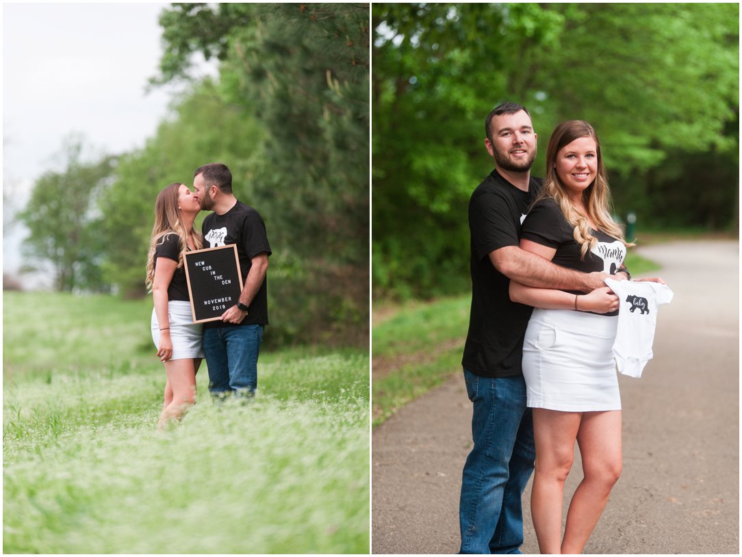 baby announcement standing in tall grass with sign