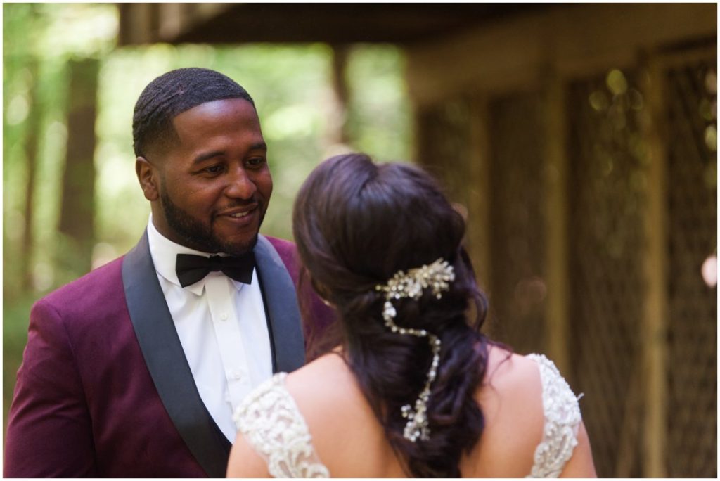 Outdoor Spring Wedding groom smiling at bride