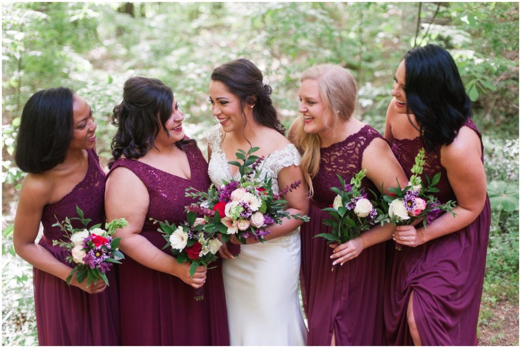 Outdoor Spring Wedding bride laughing with bridesmaids