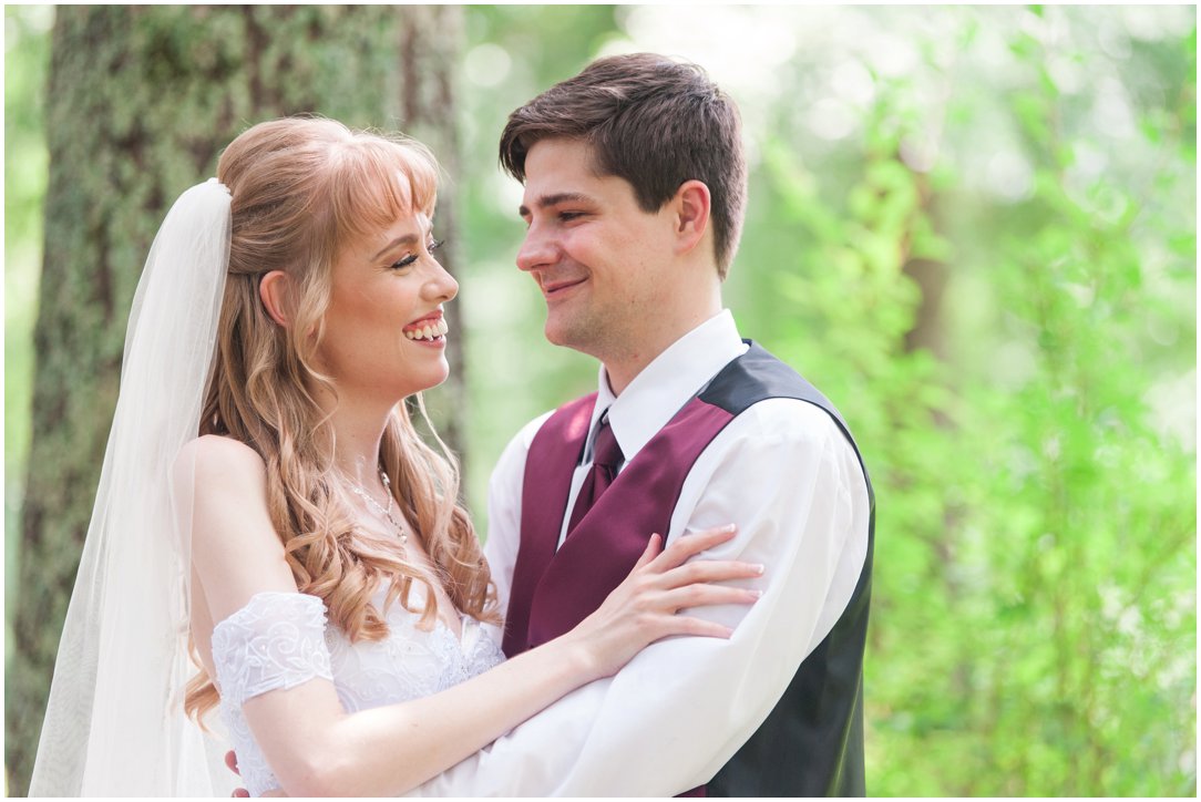 Summer lakeside Wedding close up of couple in front of tree