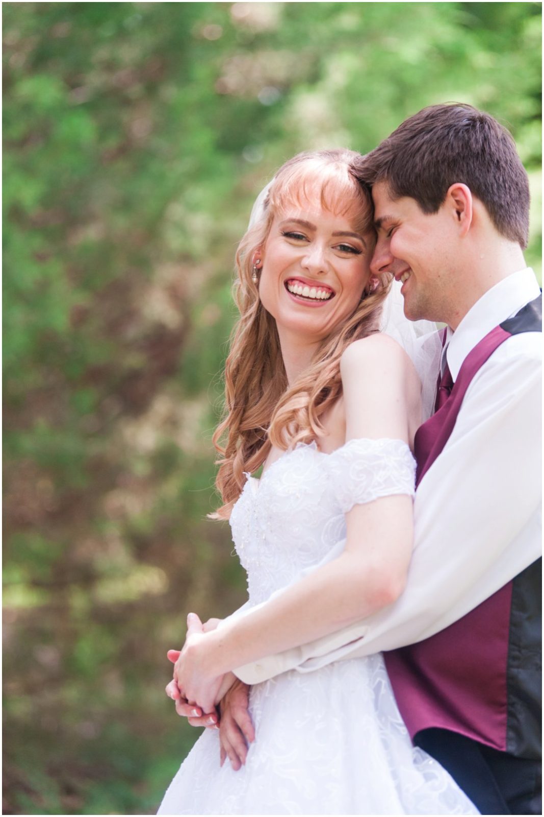 Summer lakeside Wedding couple laughing pose