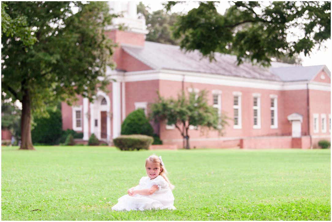 kid portrait sitting in grass