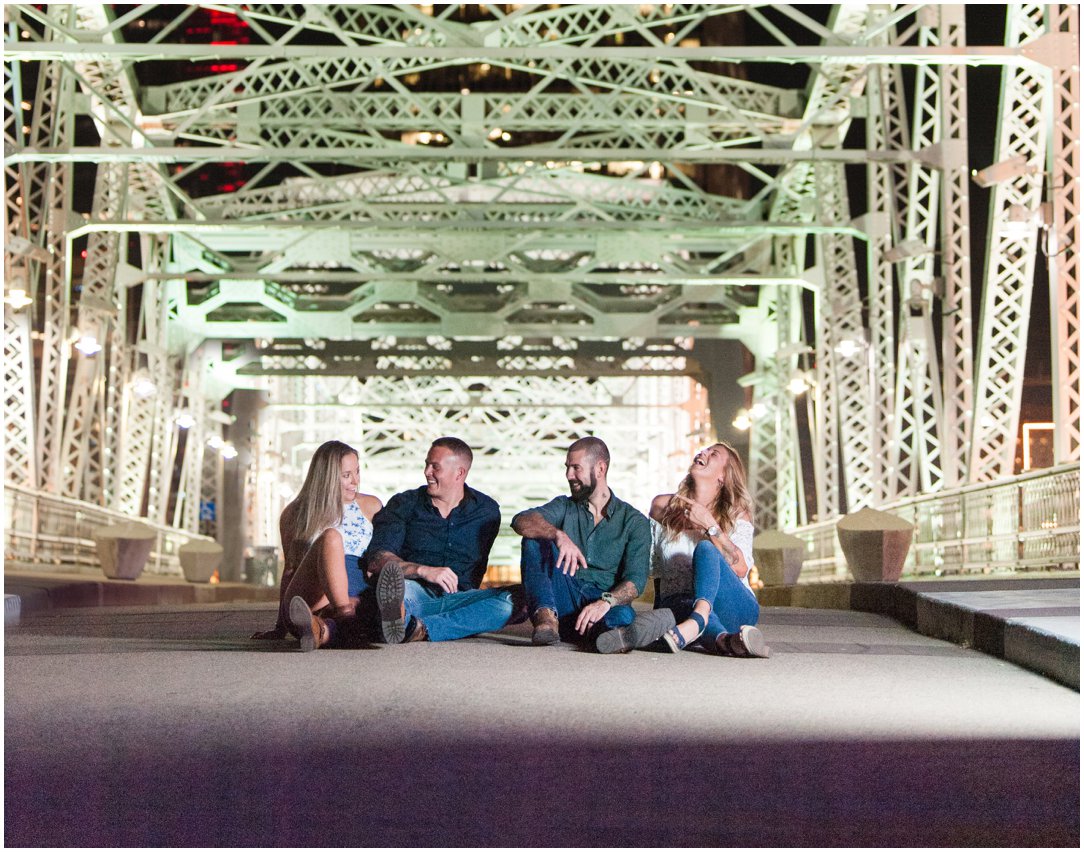 friends sitting on Nashville Pedestrian Bridge