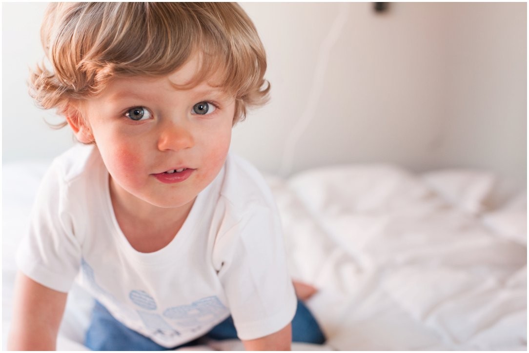 two year old boy on bed