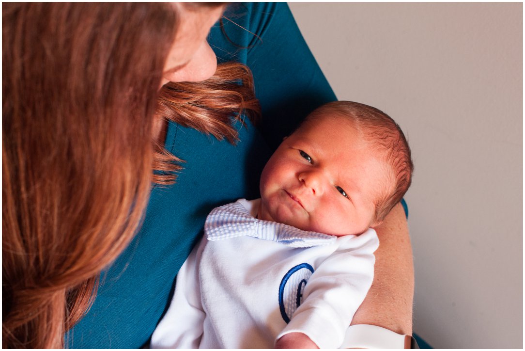 newborn looking up at mom