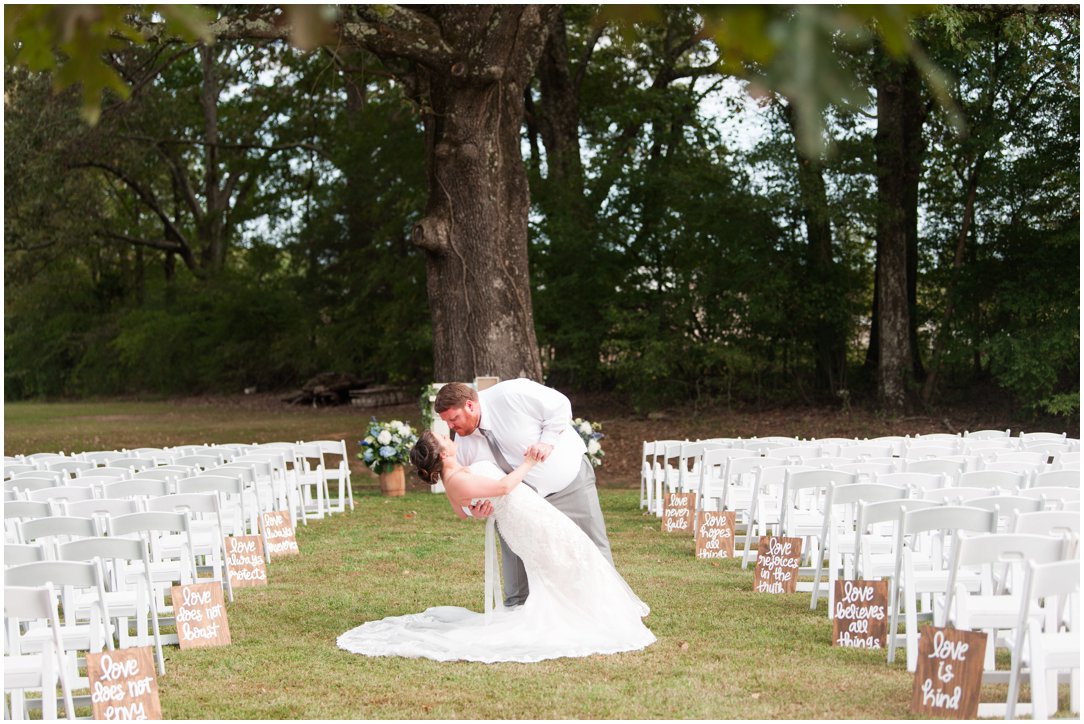 Fall Farm wedding groom dipping bride in aisle