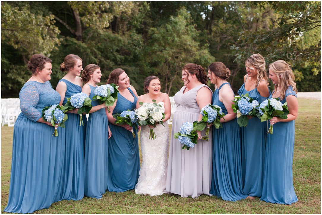 bride and bridesmaids laughing