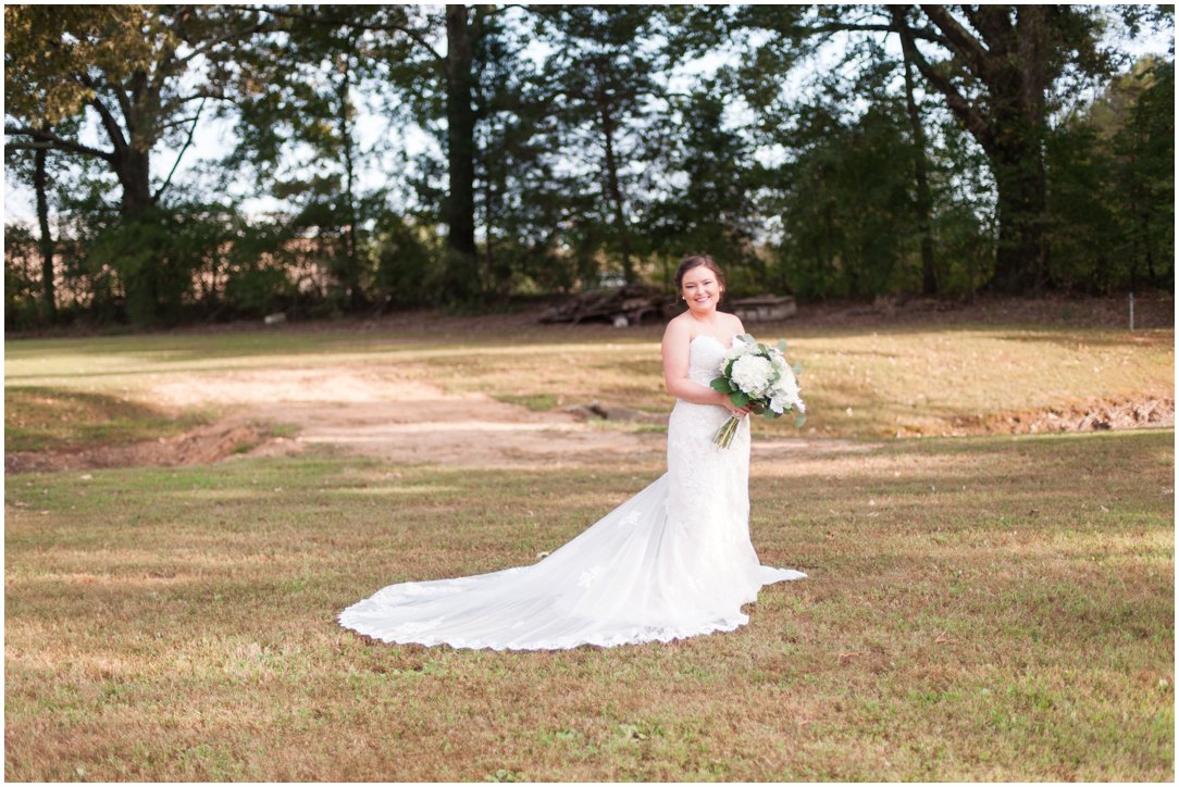 bride in field fall farm wedding