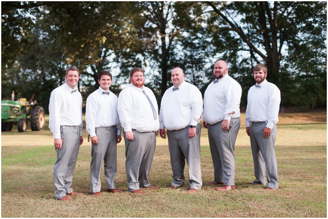 groom and groomsmen in field