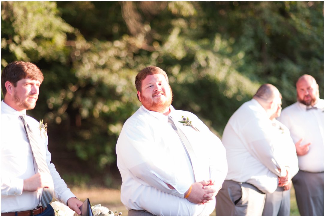 groom waiting for bride to come down aisle