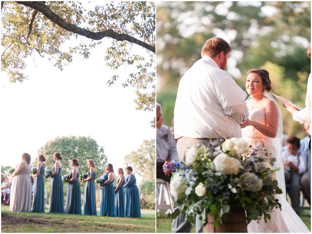 bridesmaids and bride and groom by large tree