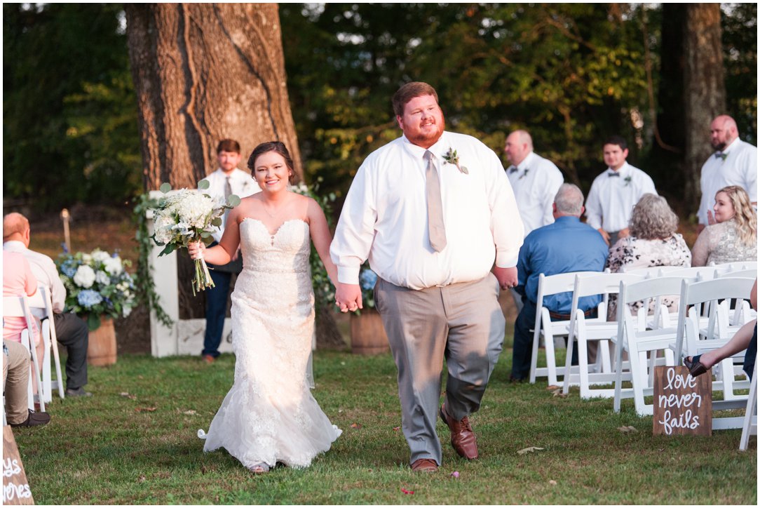 bride and groom coming down the aisle