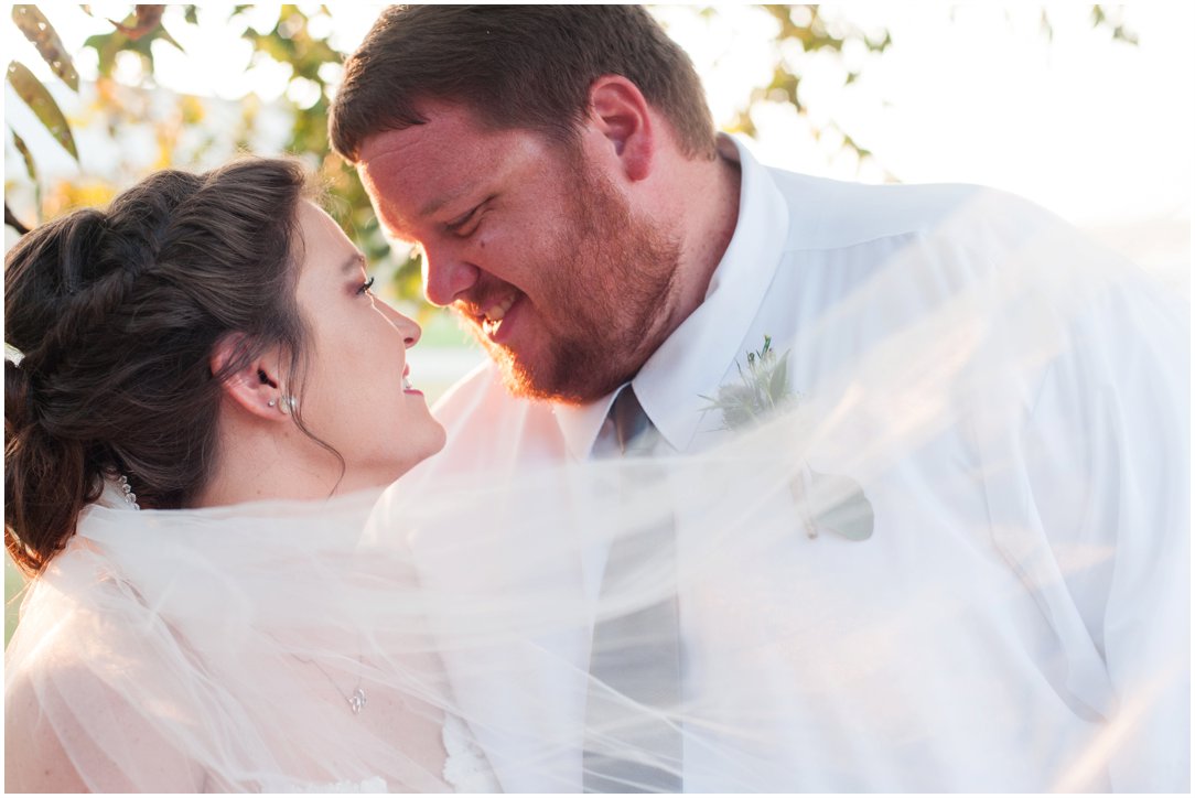 bride and groom with veil swooping