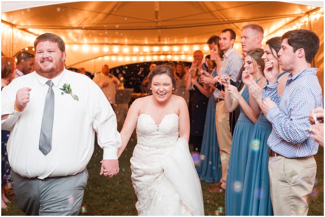 bride and groom leaving reception