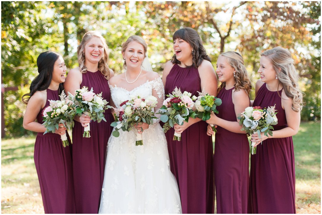 bride and bridesmaids in maroon