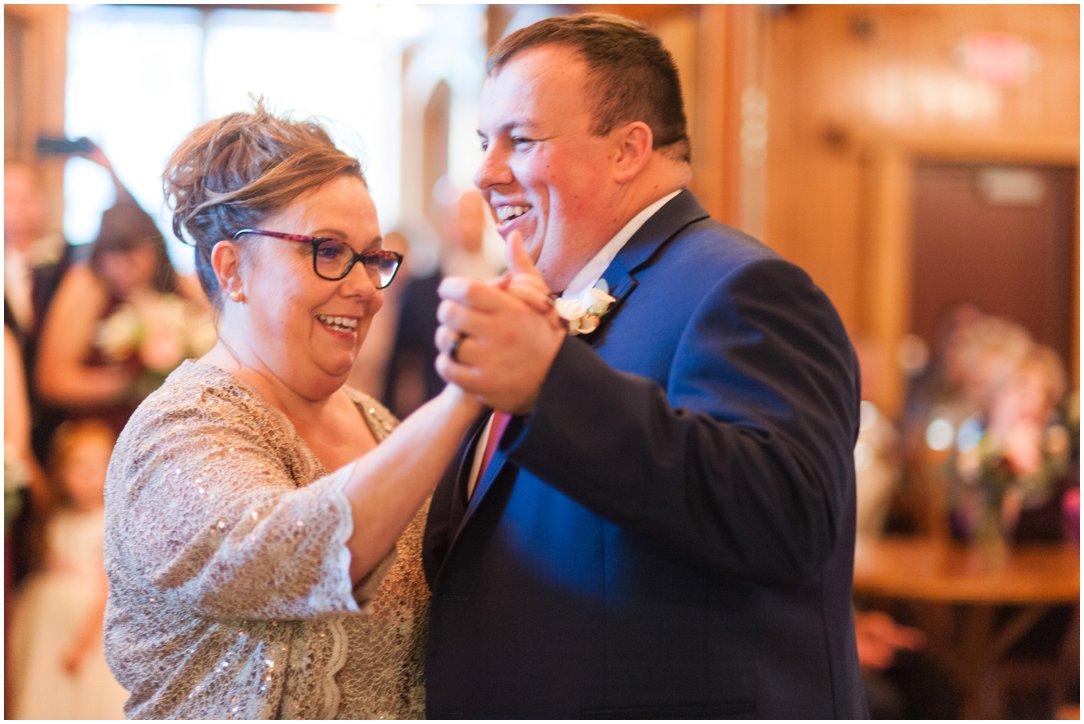 groom dancing with mother