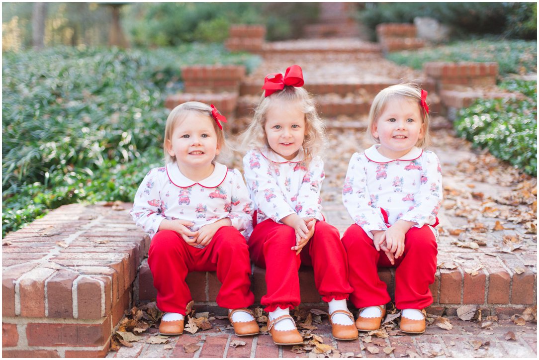 triplets in christmas clothes