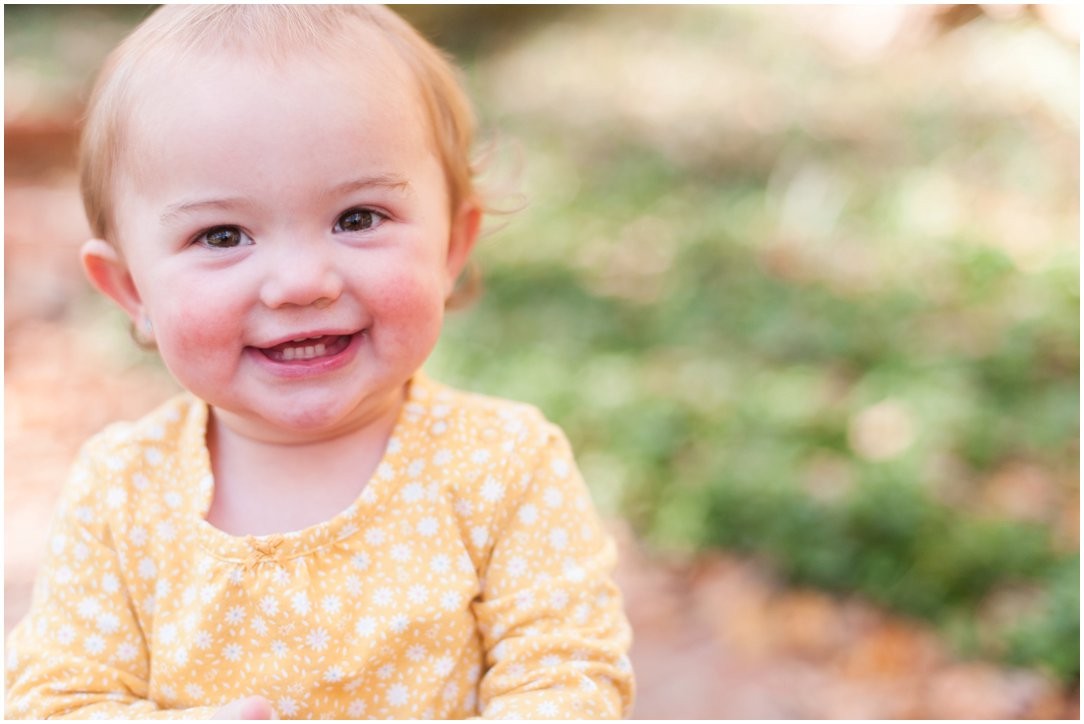 little girl in yellow smiling