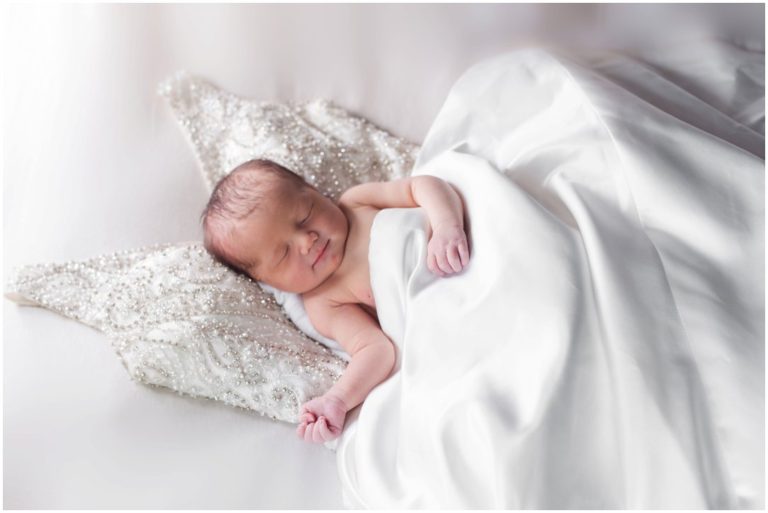 newborn on mom's wedding dress