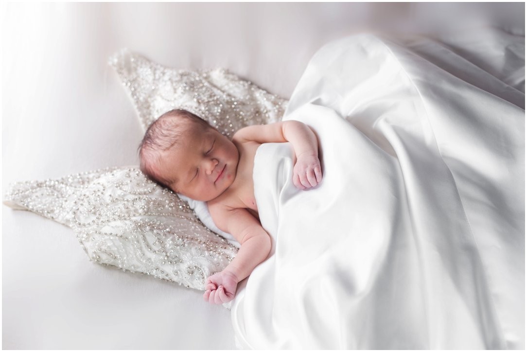 newborn on mom's wedding dress