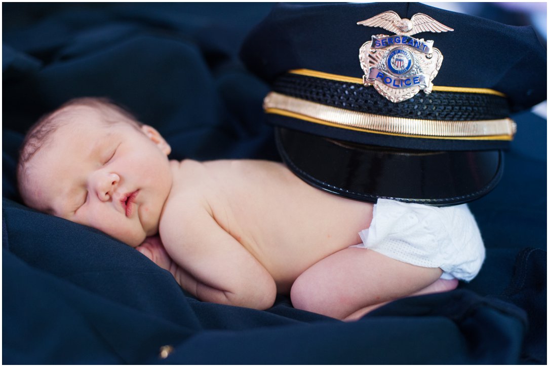 newborn with police hat