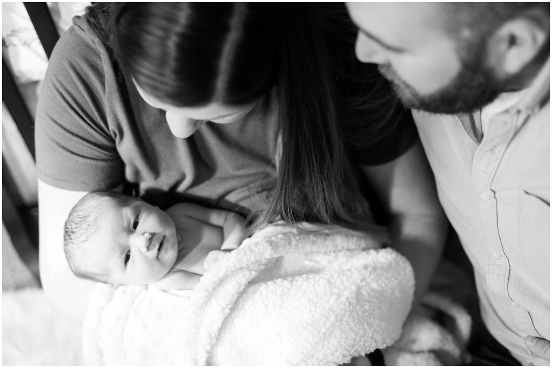 newborn with parents black and white